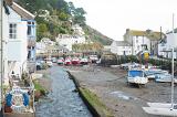 a view of polperro harbour at low tide