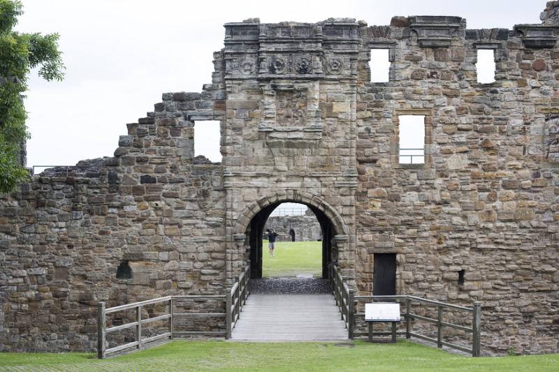 Bright sky showing through windows and doorway at front of Saint Andrews castle in Scotland