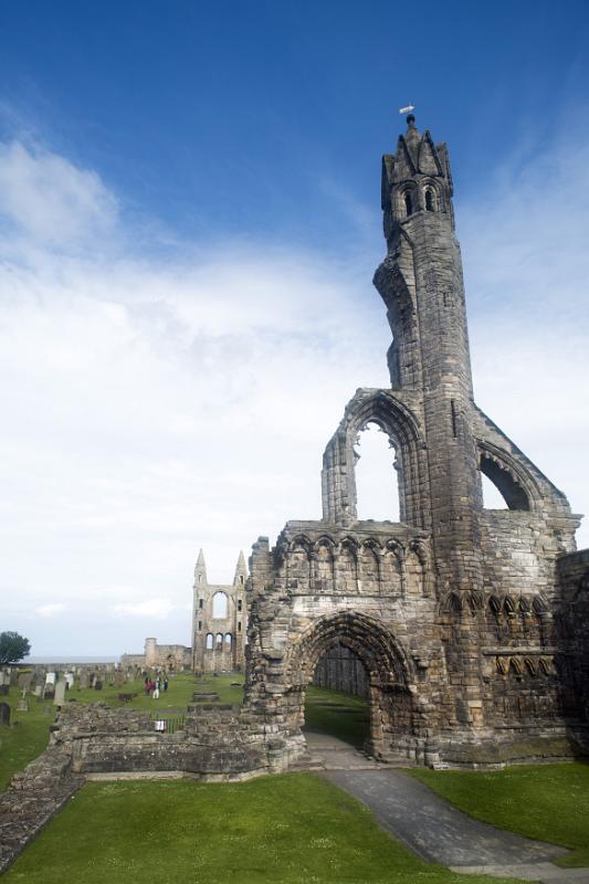 Beautiful Scottish ruins of St. Andrews cathedral as feathery clouds stretch overhead