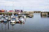 Motorboats and sailboats moored in the sheltered water in Anstruther harbour, Fife coast, Scotland
