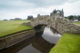 Close up view of the picturesque stone Swilken Bridge, St Andrews Golf Course , Scotland with the town visible in the distance across the green fairways