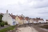 Scenic seaside village in Scotland on low tide and under a cloudy afternoon