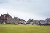 View across an open field of St Andrews, Scotland with its historic architecture in a scenic landscape for a travel and tourism concept