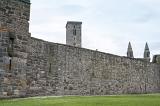 Green grass in foreground of outer wall for the old Saint Andrews Cathedral in Scotland. Includes copy space.