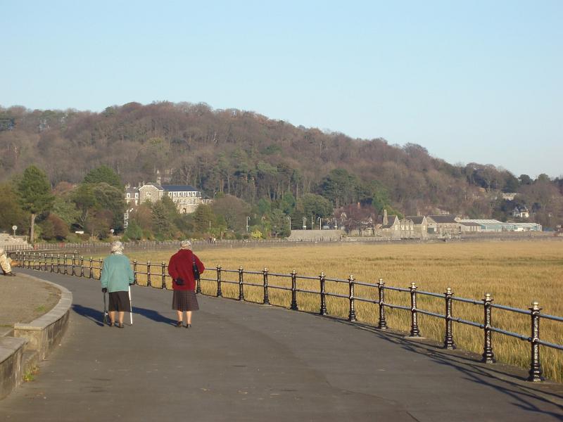 two seniors taking a stroll in grange-over-sands