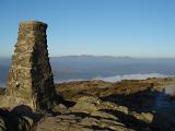 stone triangulation post on top of a cumbrian hill