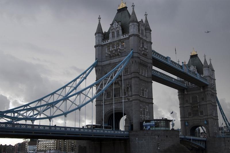 tower bridge crosses the river thames with a suspension and lifting bascule structure