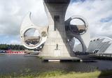 View from under viaduct at the giant Scottish Falkirk Wheel boat lift rotating showing off gears which hold boats