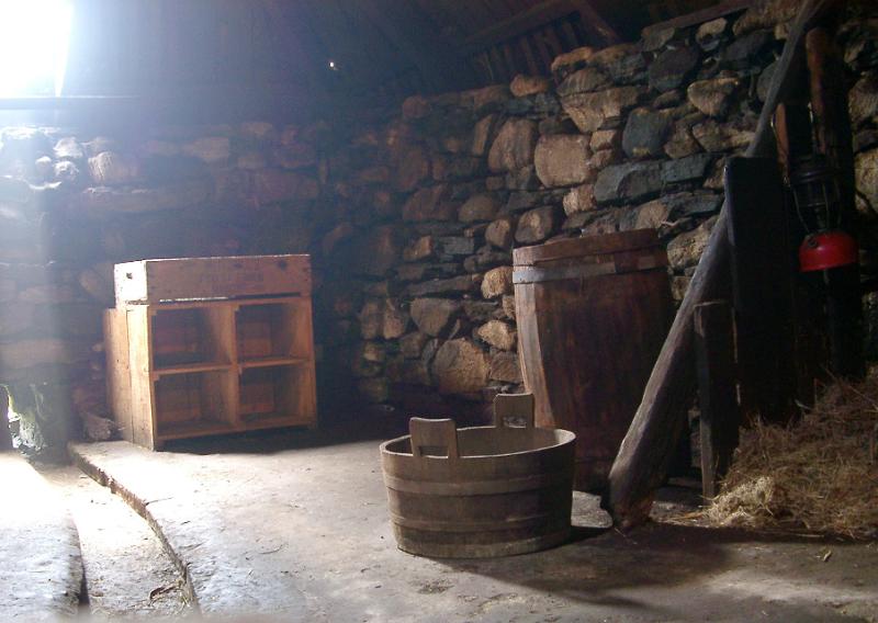 Interior of Traditional Scottish Stone Blackhouse with Historic Artifacts