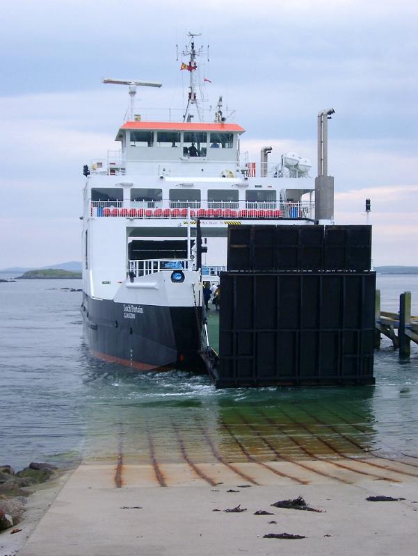 Large black and white ferry Resting at the Sea Port, with clear sea water, in Scotland