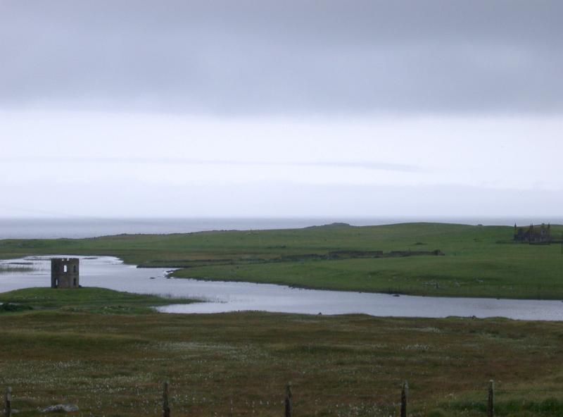 Landscape view of the historic Scolpaig Tower, a Georgian folly near the village of Scolpaig, Isle of North Uist, Outer Hebrides built around 1830 to provide employment during a time of famine