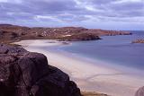 Landscape view of a quiet tranquil Hebridies beach with golden sand on the Isle of Lewis, Scotland
