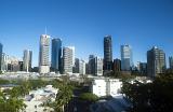 A beautiful, panoramic view of Brisbane city skyline with skyscrapers, buildings and river on a clear, blue sunny day.