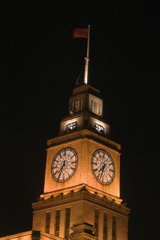 Famous Big Clock on Eight Storey Custom House Wall at the Bund, Shanghai China. Captured at Night Time.