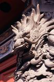 Close up Artistic Vintage Stone Temple Dragon Sculpture in Hong Kong China.