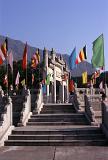 Various Flags on Poles Along the Vintage Pathway of Famous Buddhist Temple in China.