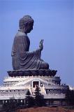 Big Buddha statue, Hong Kong, Tian Tan Buddha, also known as the Big Buddha, is a large bronze statue of a Buddha Amoghasiddhi situated on a moutain peak above the monastery on Lantau Island