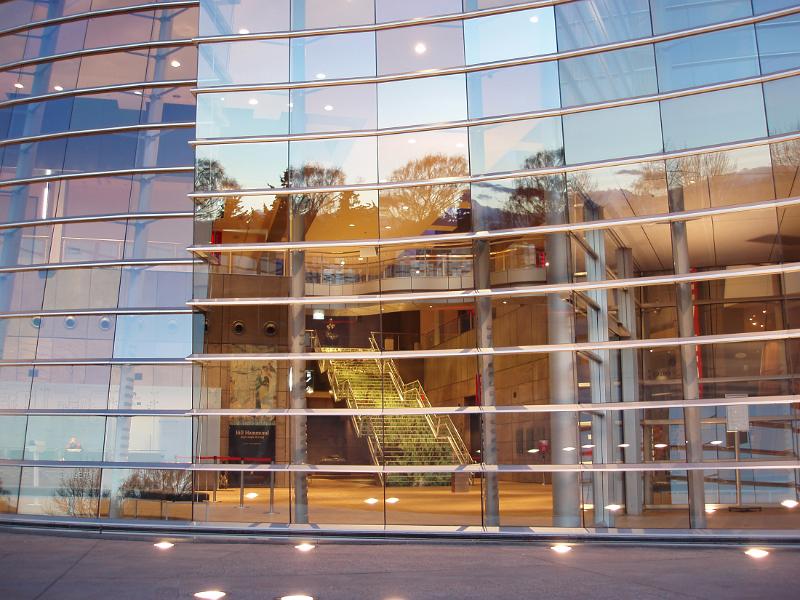 reflective glass font of the christchurch art gallery at sunset