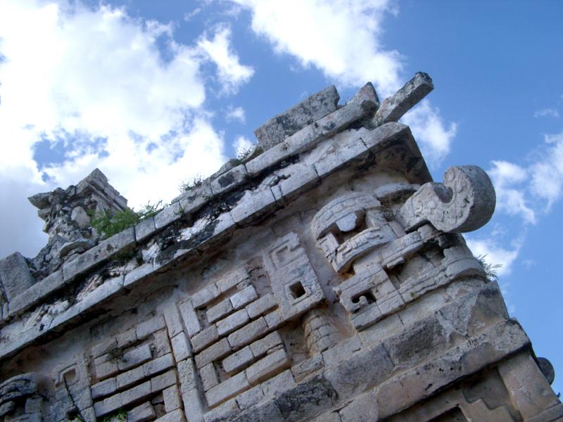 Looking Up of Carvings at Chichen Itza Mayan Ruins Against Blue Sky, Yucatan, Mexico