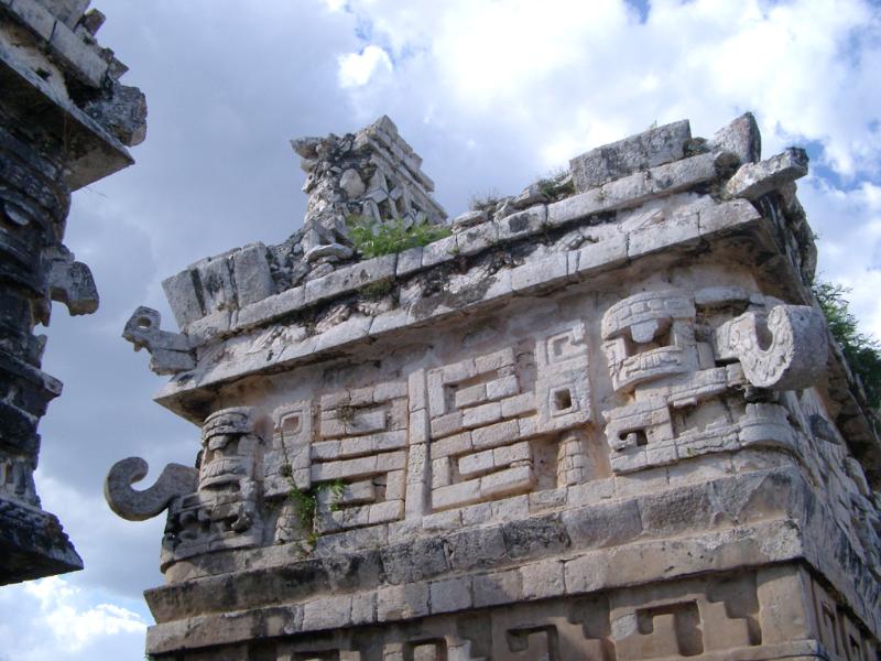 Ornate stone carvings with tribal patterns and hooked corner stones at Chitzen Itza Mayan ruins, an important archaeological site in the Yucatan Peninsula, Mexico