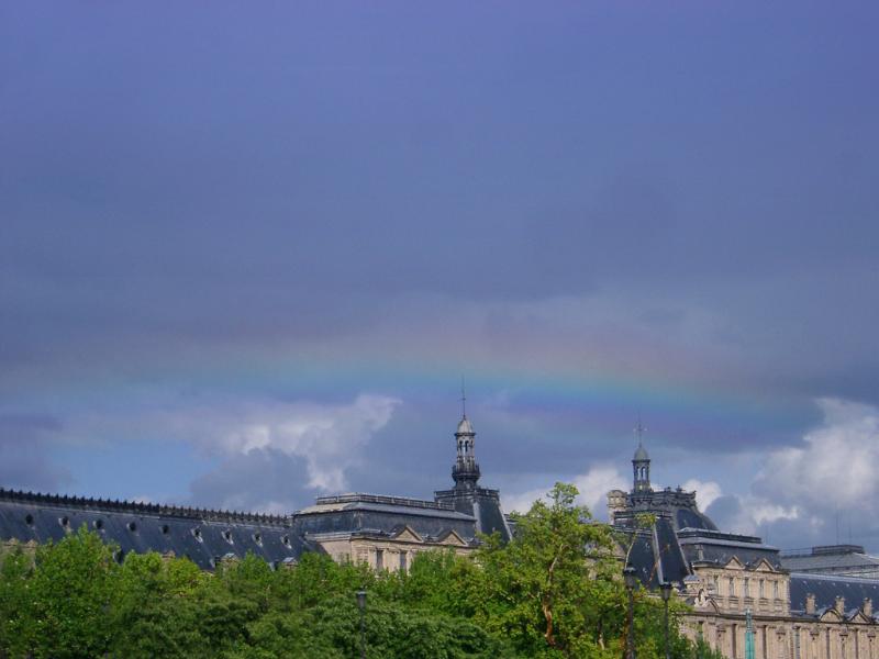 Rainbow over Louvre Museum Rooftop in Paris,France