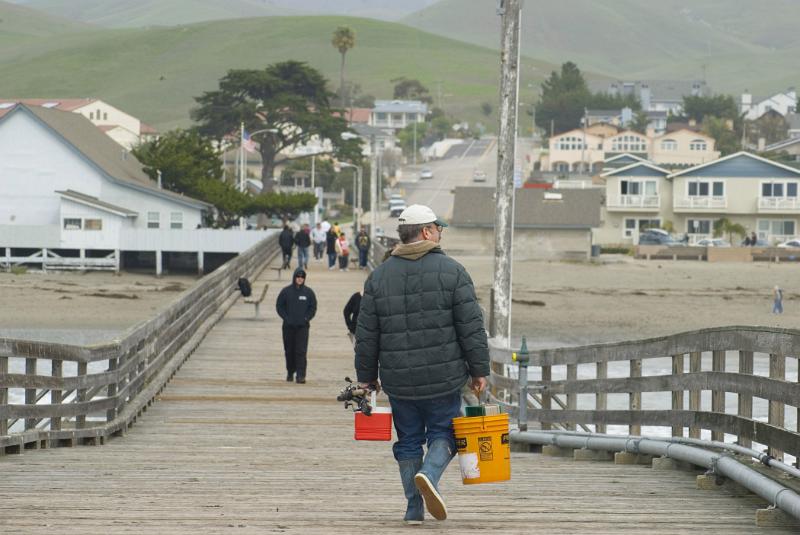 Fisherman with Buckets on Cayucos Pier, California, USA
