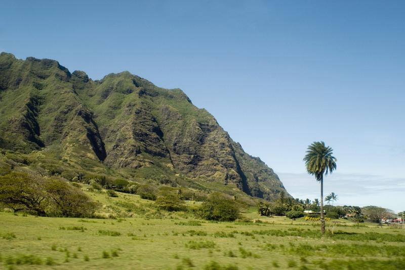 Beautiful Spot at Koolau Mountain Range Beautiful Greenery Spot at Koolau Mountain Range. Isolated on Light Blue Sky Background.
