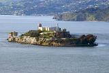 Scenic view of Alcatraz Island in San Francisco Bay with its famous impenetrable fortress prison, now decommissioned and a popular tourist attraction