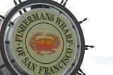 Close up Big Fishermans Wharf Signage of San Francisco on White Sky Background.