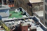 View looking down on San Francisco rooftops with recreational areas and sun loungers for enjoying the summer sunshine