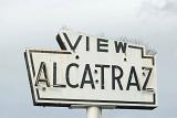 Close up Vintage View Alcatraz Signage Found in San Francisco. Captured on Lighter Blue Gray Sky Background.