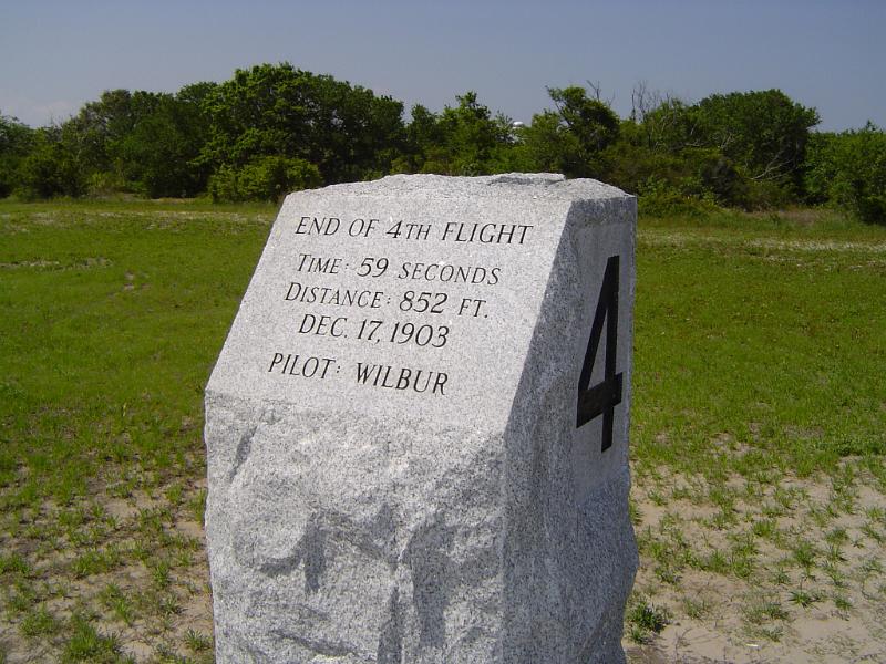 Kitty Hawk memorials with a marker for the fourth flight by Wilbur and Orville Wright showing the duration and distance