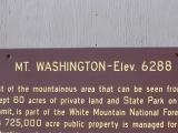 Mount Washington information sign giving details of the elevation and size in close up detail