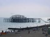 Famous Old Damaged West Pier Due to Heavy Storms in 1975 at Brighton, England. Captured with Tourist Relaxing on the Beach.
