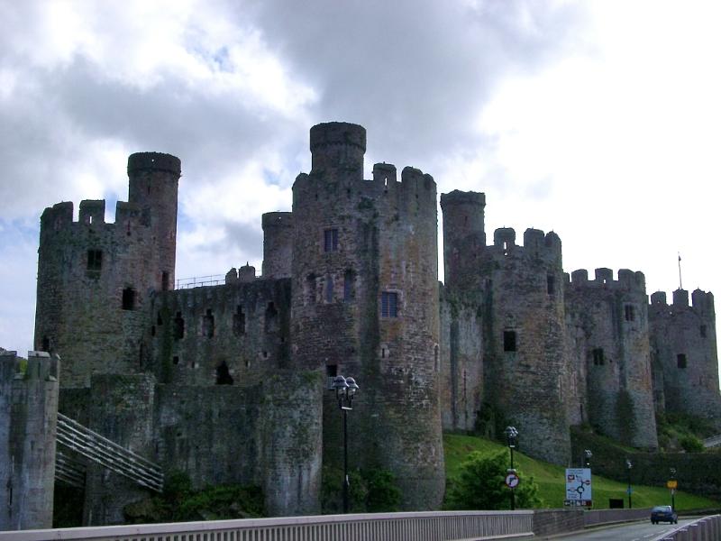 Conwy Castle - Famous Ancient Landmark of Conway, Wales on a Grassy Landscape.