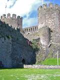 Conway Castle Building on Grassy Landscape. Located in Wales. Captured on a Sunny Day.