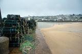 Crab or Lobster traps piled up on the quayside at Saint Ives harbour, Cornwall, UK
