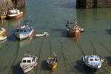 small fishing boats in the harbour at newquay