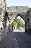 Large equilateral type ancient archway in little street of historic Saint Andrews, Scotland