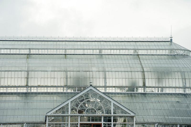 View of the domed roof and exterior facade of the People Palace Winter Gardens in Glasgow, Scotland, a huge Victorian glasshouse which now houses a museum and exhibitions