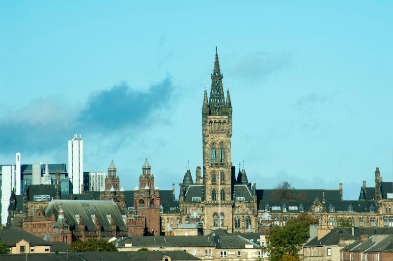 Exterior facade of the University of Glasgow, Gilmorehill campus with its historical Gothic tower and medieval architecture, the fourth oldest English speaking university in the world