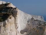 Close up Famous Textured Chalk Cliffs at Whitecliff Bay on the Isle of Wight. Captured with Blue Gray Sky Background.
