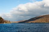 Scenic landscape view of the calm blue water of Lake Coniston in the Lake District , Cumbria