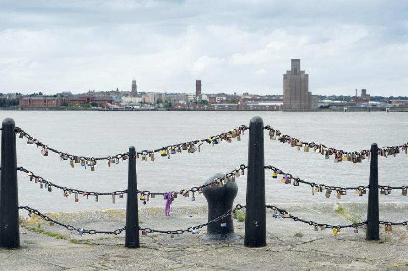 Padlocks on the railings Mersey waterfront Various padlocks on railings near old mooring posts at Liverpool Mersey waterfront