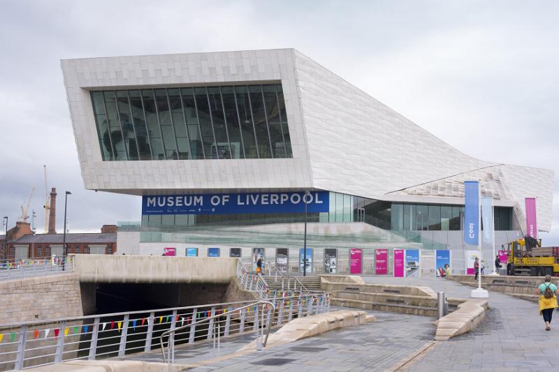 Front section of the Museum of Liverpool Person walking up road near front section of the Museum of Liverpool in the United Kingdom