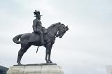 Side view of Edward the Seventh sitting on horse statue with copy space in overcast gray sky