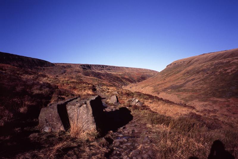 Pennines landscape with grassy moorlands, rocks and hills in North West England
