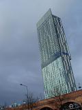 Famous Architectural Beetham Tower, also known as Hilton Tower, a 47-storey mixed-use skyscraper in Manchester, England on Gray Sky Background.