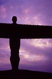 Close up detail of the body of the Angel of the North silhouetted against a vivid purple sunset sky, Gateshead, Newcastle