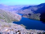 View from Snowdon of a beautiful blue mountain lake in the Welsh wilderness, Gwynedd, Wales, UK